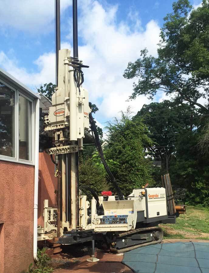 One tight area! Active Environmental experienced just how versatile the 3230DT rig can be by snugging up to a residence to install a monitoring well.