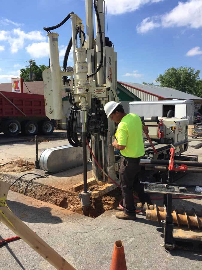 A Geoprobe® 7822DT, connected to an air compressor, is used to install monitoring wells at an underground storage tank site by Cory Walker, Owner of CORTEK Drilling.