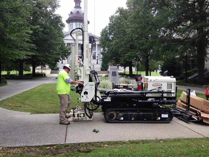 Kyle King, Driller for Elite Techniques, and a 7822DT are soil sampling on the South Carolina State House lawn.