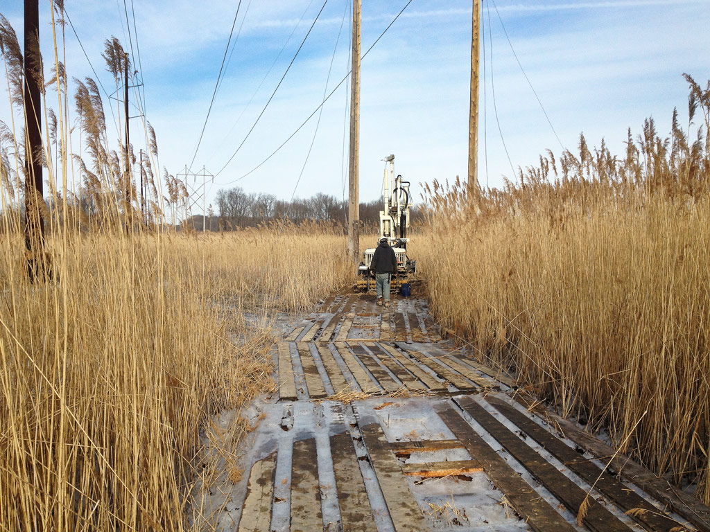 A 7822DT, owned by John D. Hynes & Associates, Inc., in Salisbury, MD, uses logging mats to access transmission lines 1,200 ft. out into a marsh to drill boring foundations for new utility poles.