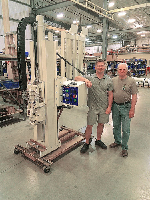 Rob and his father, Bob McAllister, spend some get-acquainted time in Geoprobe® Assembly with the new 5410 unit that will be installed in Rob’s new Silver Ford F350.