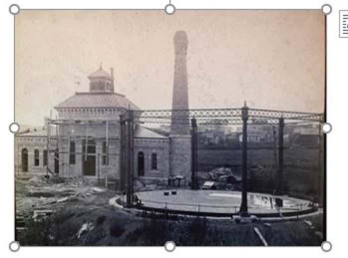 The Wellington, KS, Manufactured Gas Plant (MGP) under construction circa 1886.  Note the gas holder in the right foreground.  It was destroyed and backfilled after the plant closed. 