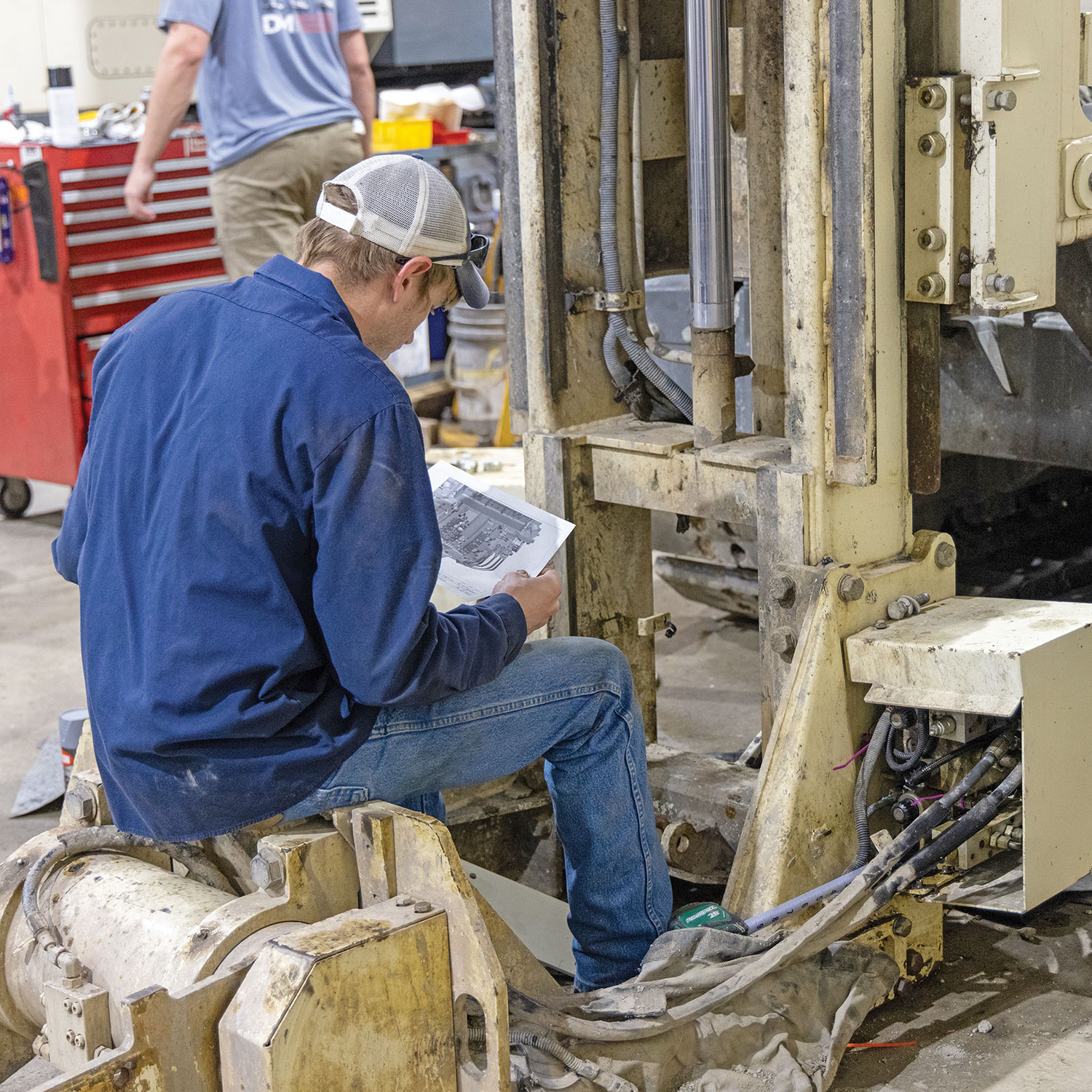 Bryce Nichols, service technician and former machine design engineer, refers to documentation while preparing to install the V3 sonic breakout on the legacy 8150LS sonic rig.
