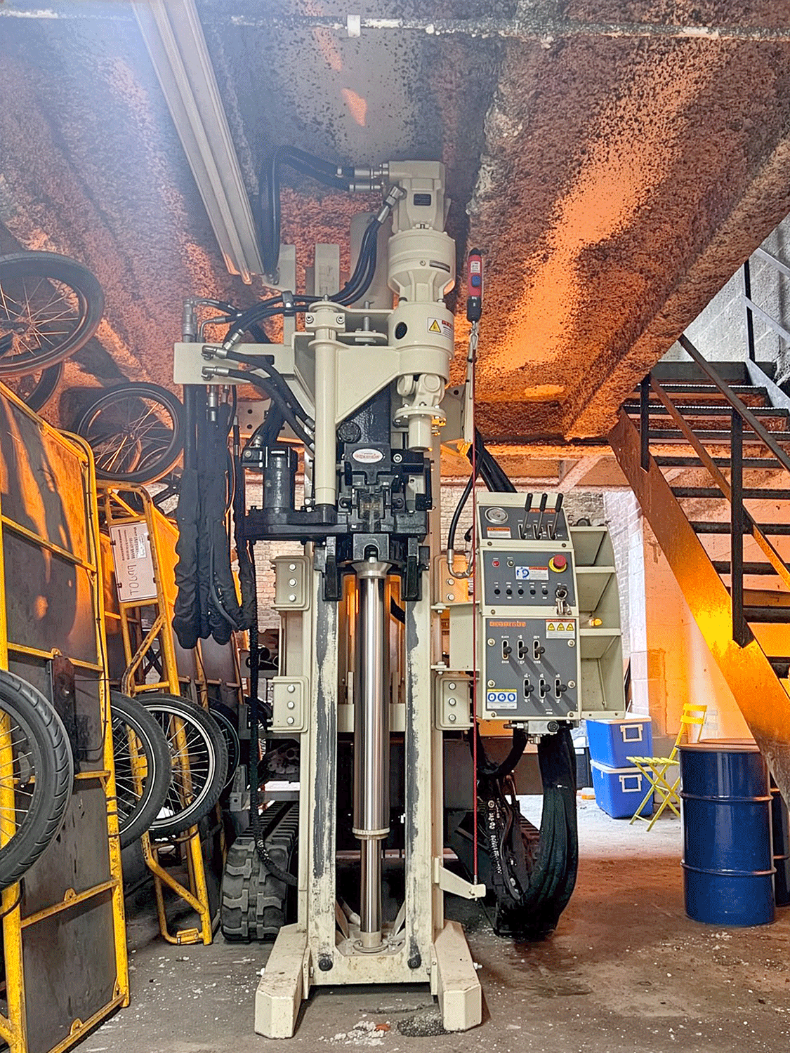 Limited access drilling poses few challenges for the size and power of the 6011DT outfitted with a GH60 percussion hammer and rotary head.