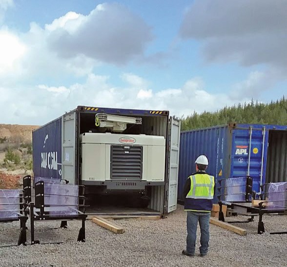 Compact 8150LS sonic core drilling rig fits inside a 40-foot shipping container for international transportation.