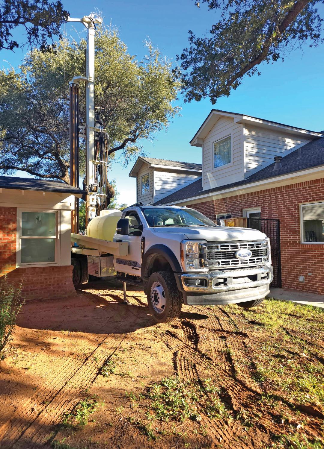 Compact DM250 slips into tight residential lots when drilling water wells, satisfying customers particular about their landscaping.