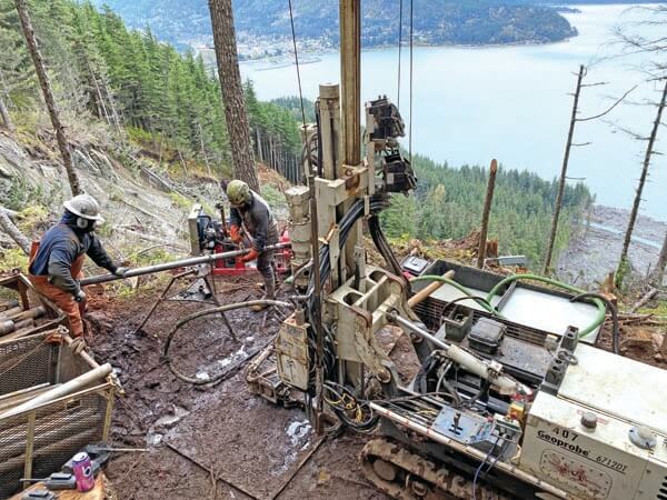 Operating adjacent to the landslide, the crew opens the inner tube from a 5-foot HQ rock core run collected more than 100-feet below ground surface. Core recovery has been routinely at or near 100 percent with the GA3100 4-speed rotary head on the 6712DT and mud program.