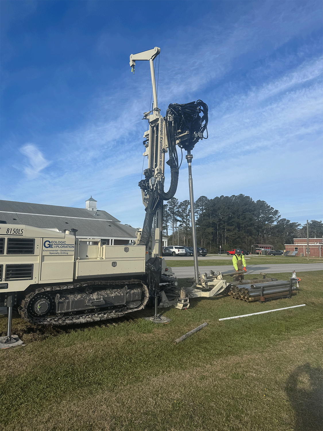 Rod handler lifting casing and breakout separating tool strings simplifies fieldwork for drillers and helpers running Geoprobe® 8150LS sonic drills.