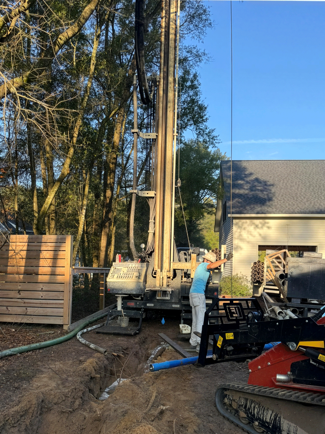 DM250 compact platform slips inbetween residential structures with top head speed and 22-foot stroke to amplify production of drilled water wells.