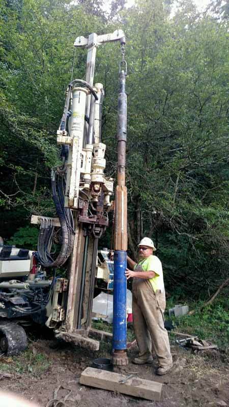 Chris Chronister, Field Superintendent for Eichelbergers, uses a 7822DT and a tool string with 8-in. air hammer and stabilizer to install a water well in a remote, protected area.