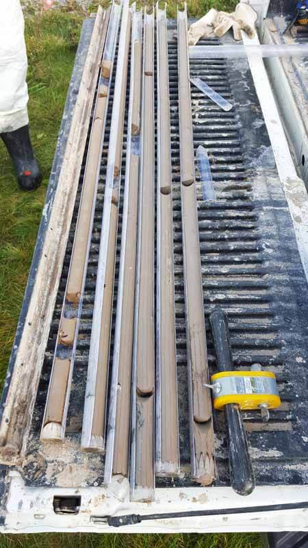 Filled DT22 soil core liners recovered by GeoServe using Geoprobe® liners and a 6620DT. The integrated core catchers in the liners (shown at end of each liner) keeps the sample from falling out the bottom of the liner as the core is retracted.