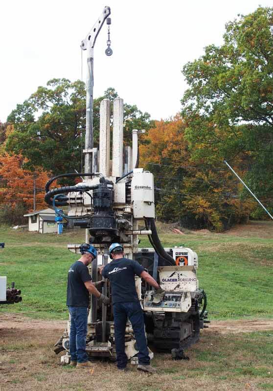 Glacier Team members Matthew Schock and Michael Also operate the 8040DT, one of Glacier Drilling’s rigs, to collect soil samples.