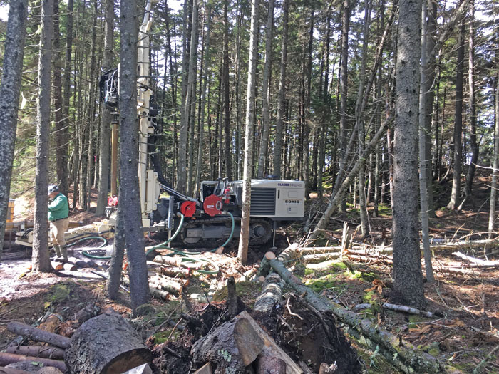 8150LS sonic drilling rig snaked between trees on Johns Island off the coast of Maine to install water well service to the house on site. A hydrologist designed the multi-well system to avoid salt water intrusion. The crew grouted in 8-inch water well casing and cored rock to 225 feet on six holes.