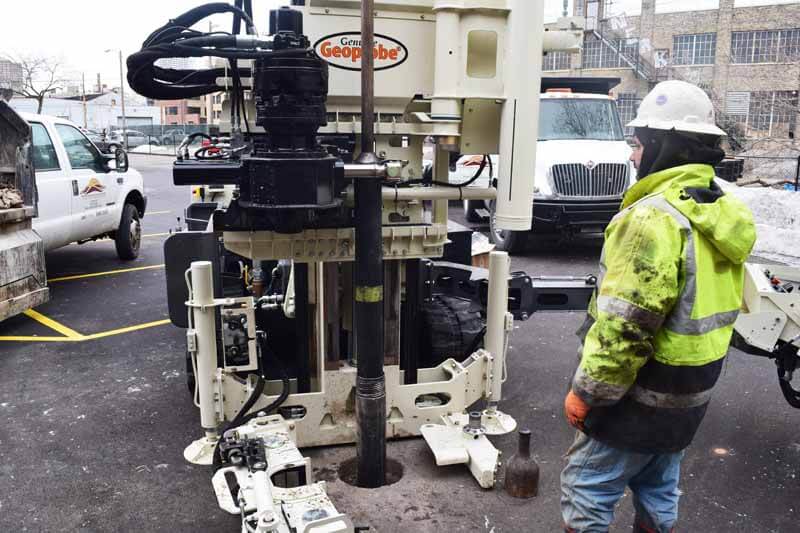 Robert Albinger uses a 3230DT to install monitoring wells in a newly paved parking lot. DT60 system was used for soil core collection and the outter casing is used for installing the well.