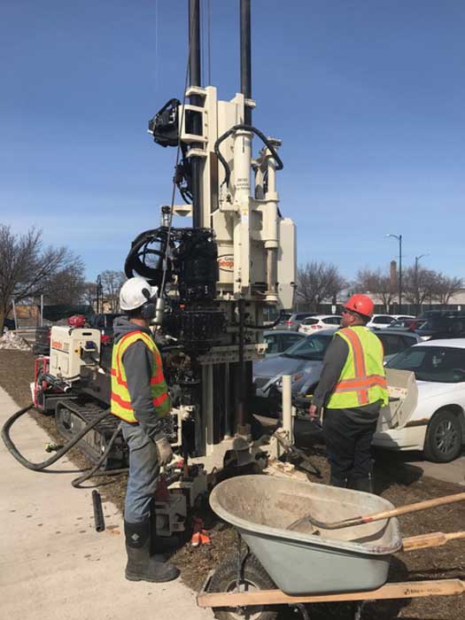 Shepler Well Drilling, Inc., completes split spoon sampling in Traverse City, MI, as part of a geotechnical site investigation for a new parking deck using their Geoprobe® 3230DT.  The torque and pull back on the 3230DT put the crew at ease knowing they can retrieve their augers no matter what depth they reach on projects. Pictured are Operators Cole Shepler and Clint Bridson with Shepler Well Drilling.