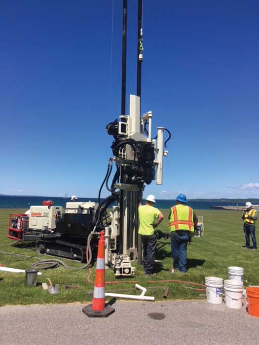 Shepler Well Drilling, Inc., President Randy Shepler and Operator Clint Bridson, advance 4.5 in. rods utilizing the GH70 percussion hammer to install wells.