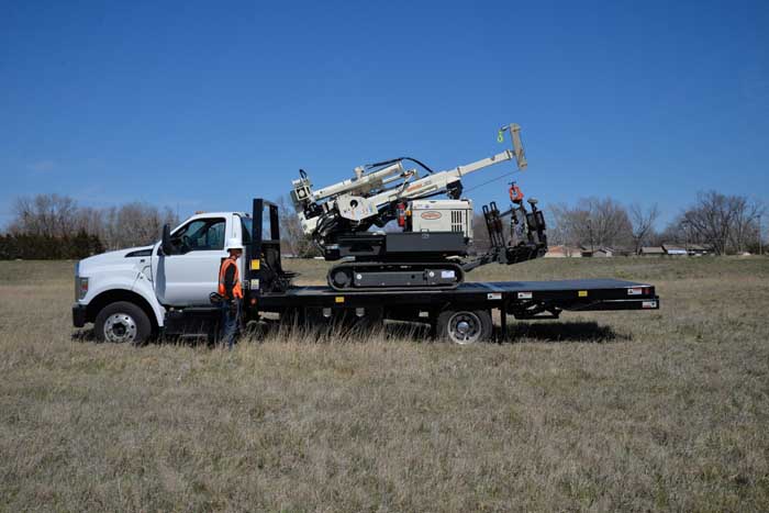 NO CDL Required: Loading and transporting a 7822DT is easy using this F650 transport truck with EZ12 bed. 