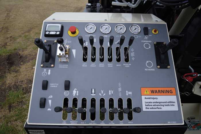 The neatly laid out DM250 control panel with engine gauge, E-stop, hydraulic pressure gauges, friction control levers for mud pump and rotation circuits, and electronic throttle controls make the DM250 simple and safe to operate.