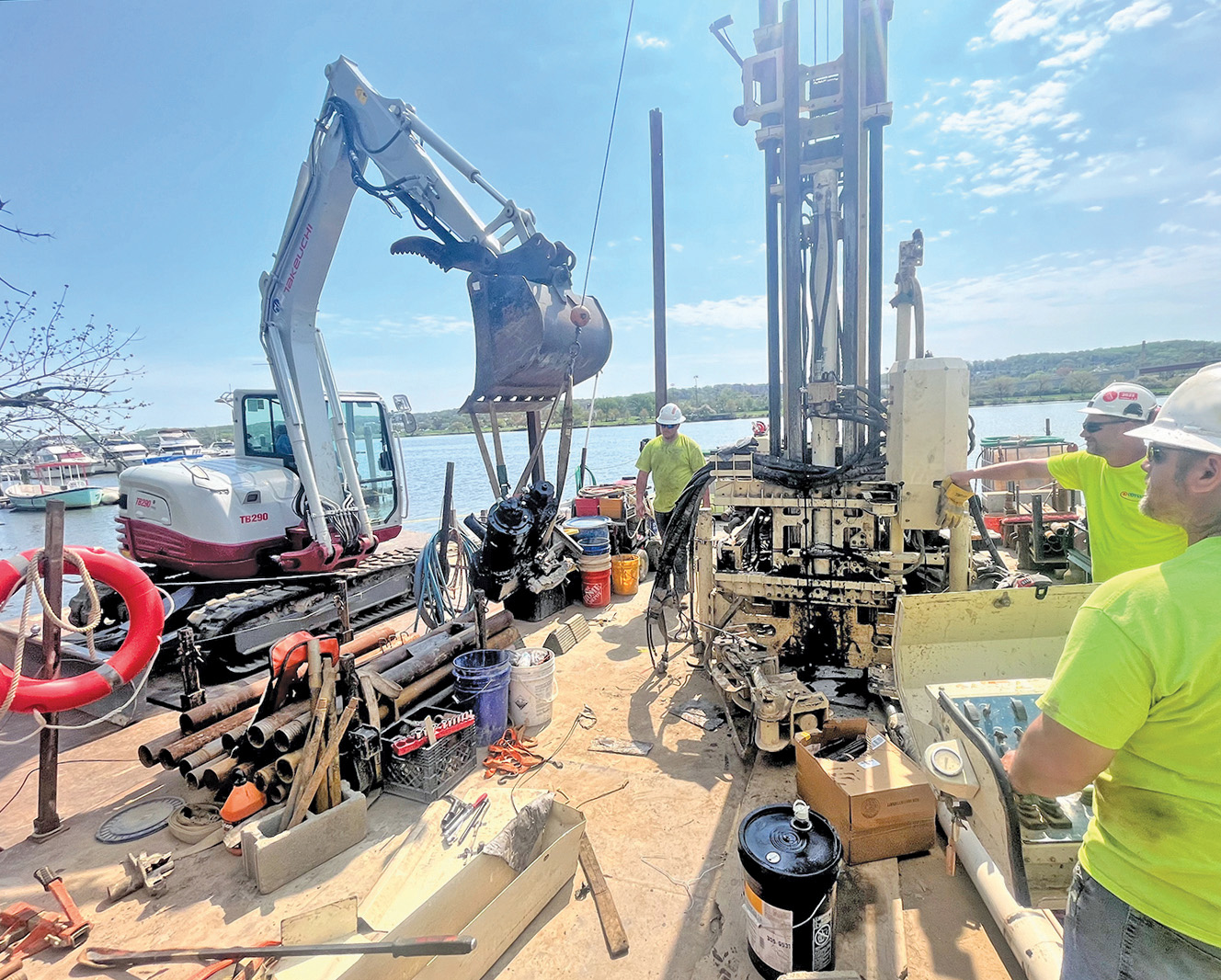 Drilling mechanic expertise facilitates 3230DT cylinder replacement within confines of barge.