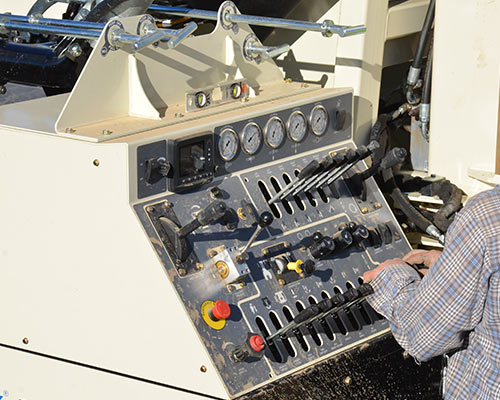 Manual hydraulic controls on DM450 deep water well drilling rig provide power, precision, and reduced maintenance.