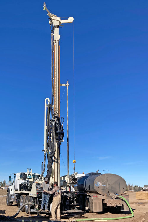 Truck-mounted drill rig with power to drill and comfort to travel mobilizes to tough drilling sites at highway speeds.