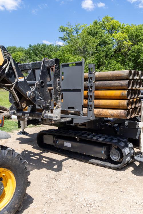 Using a forklift, the removable rod racks can be switched out to continue drilling.